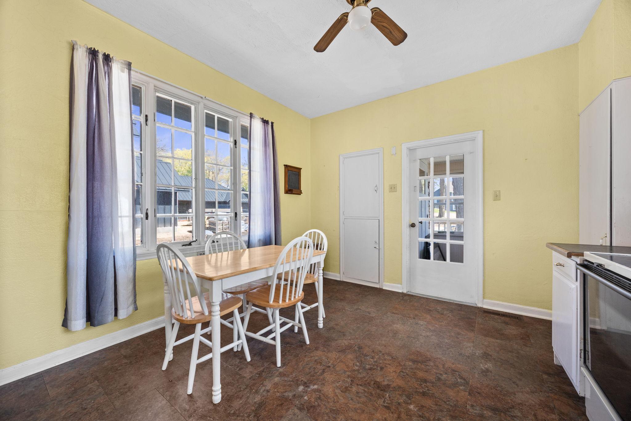 The kitchen features an informal dining area