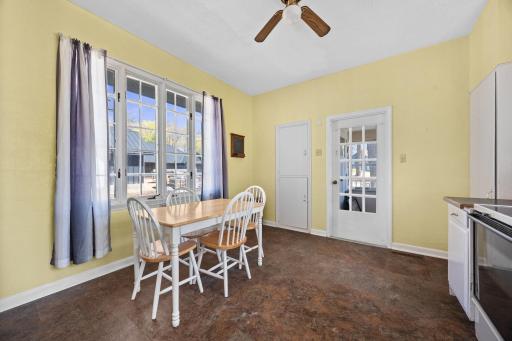 The kitchen features an informal dining area