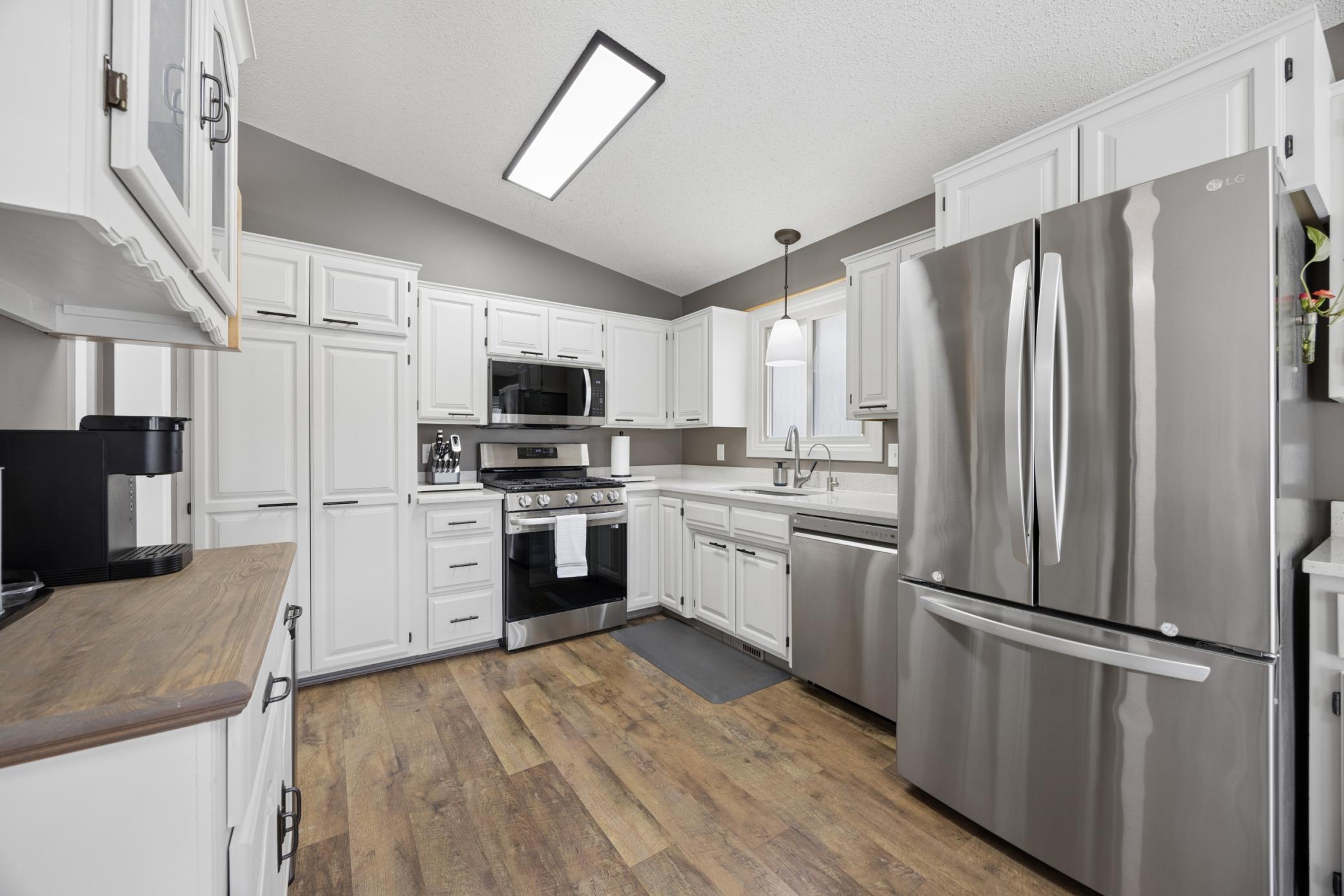 Vinyl Plank Flooring and Quartz Countertops