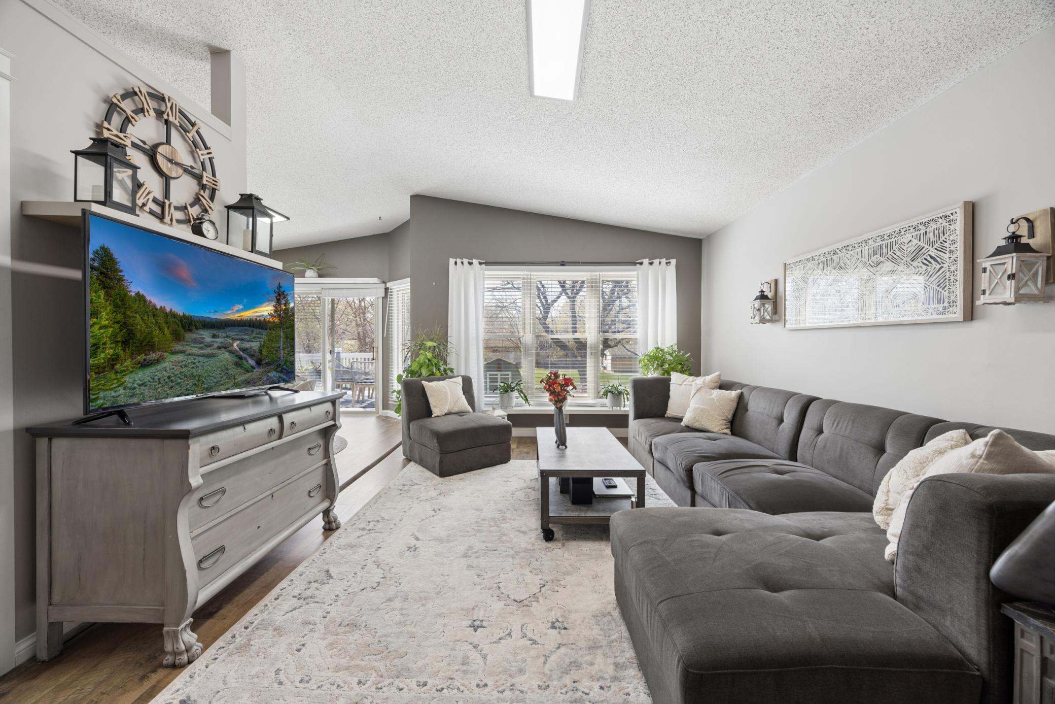 The Living Room Receives Natural Light from the Large Windows