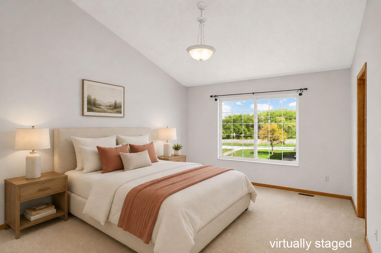 Virtually Staged - Spacious primary bedroom with vaulted ceiling