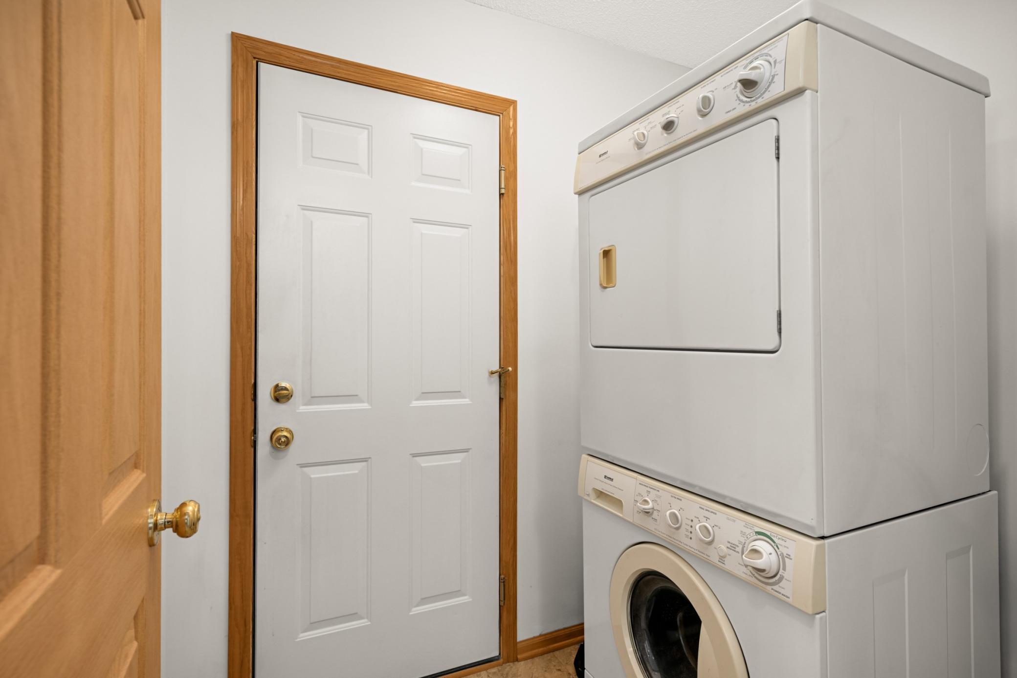 Convenient main level washer and dryer in the entryway out to the garage