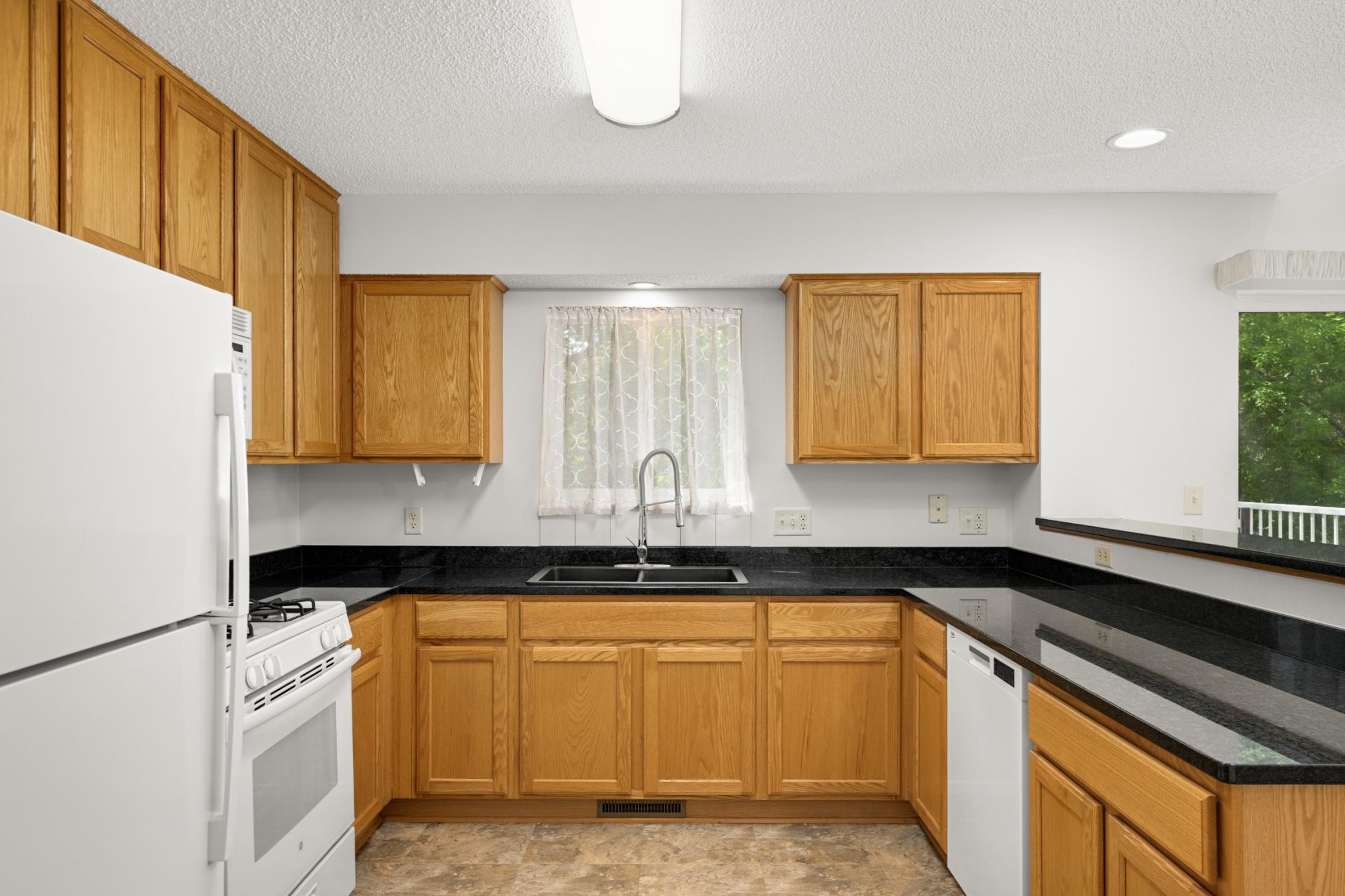 Lots of cabinetry and storage space in this well laid out kitchen