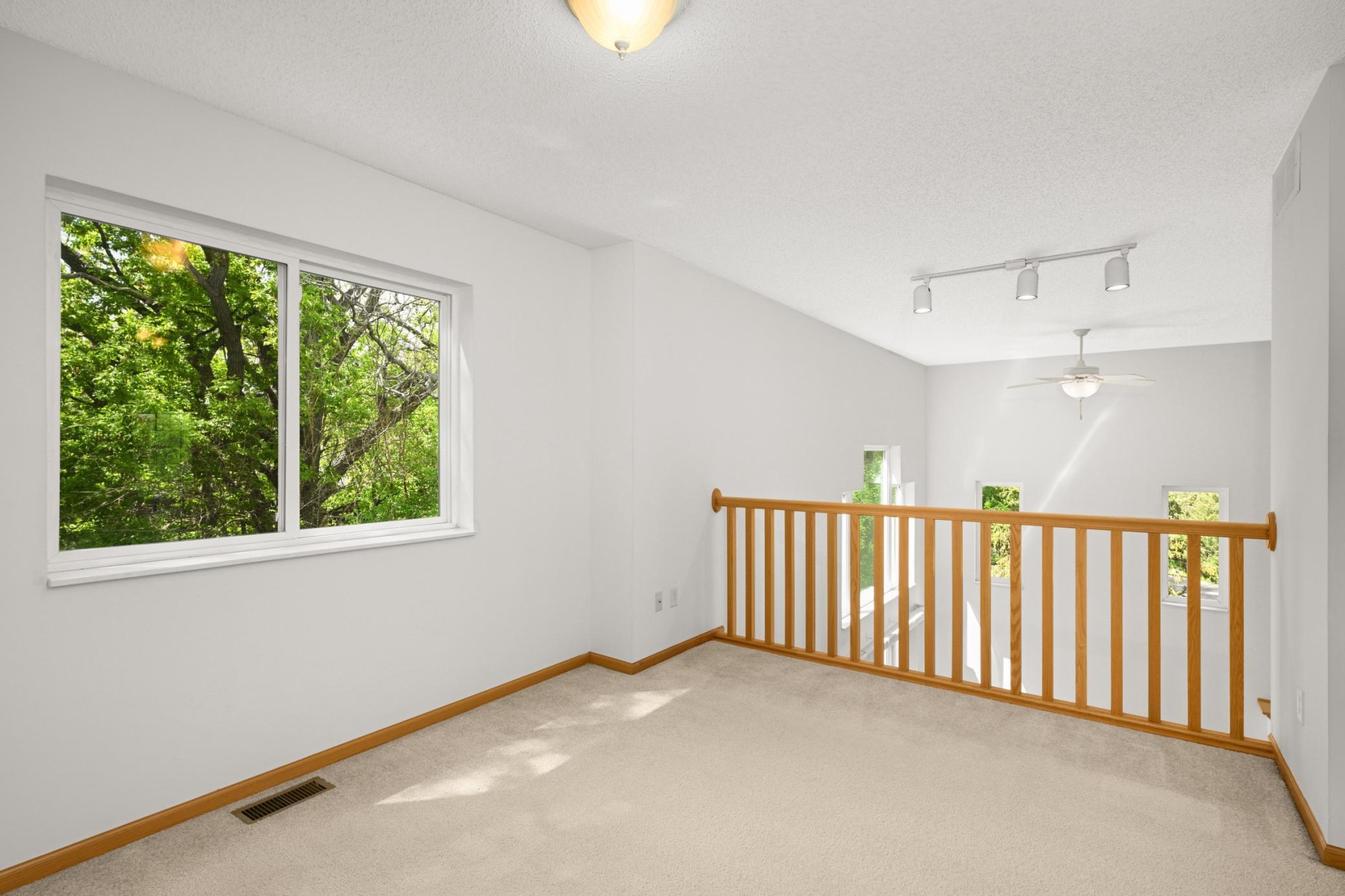 Upper level loft area would be a great home office or bonus room