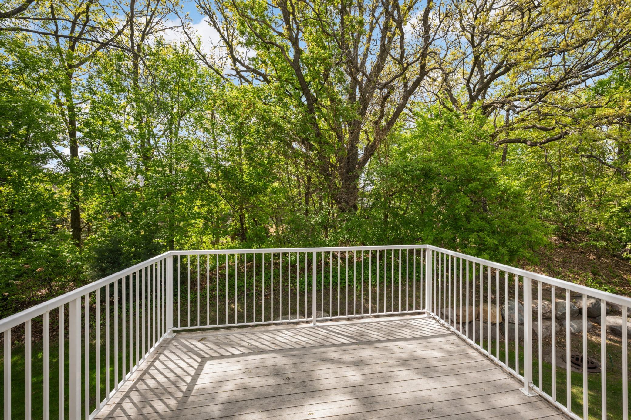You'll love relaxing on this deck with its gorgeous wooded views