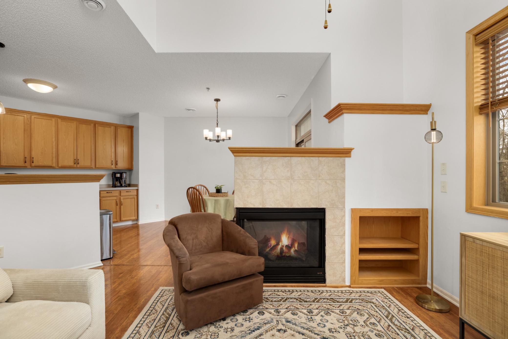 Living room opens to both kitchen and dining