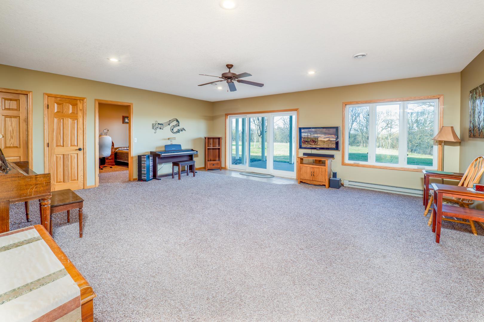 Lower level family room with patio doors to the backyard