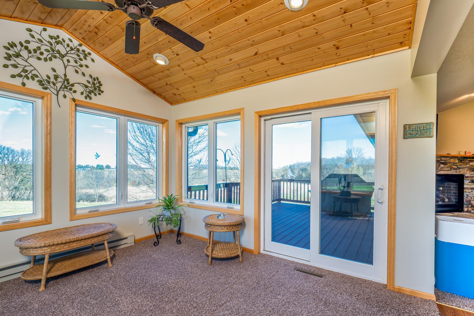 Patio doors open to the maintenance free deck