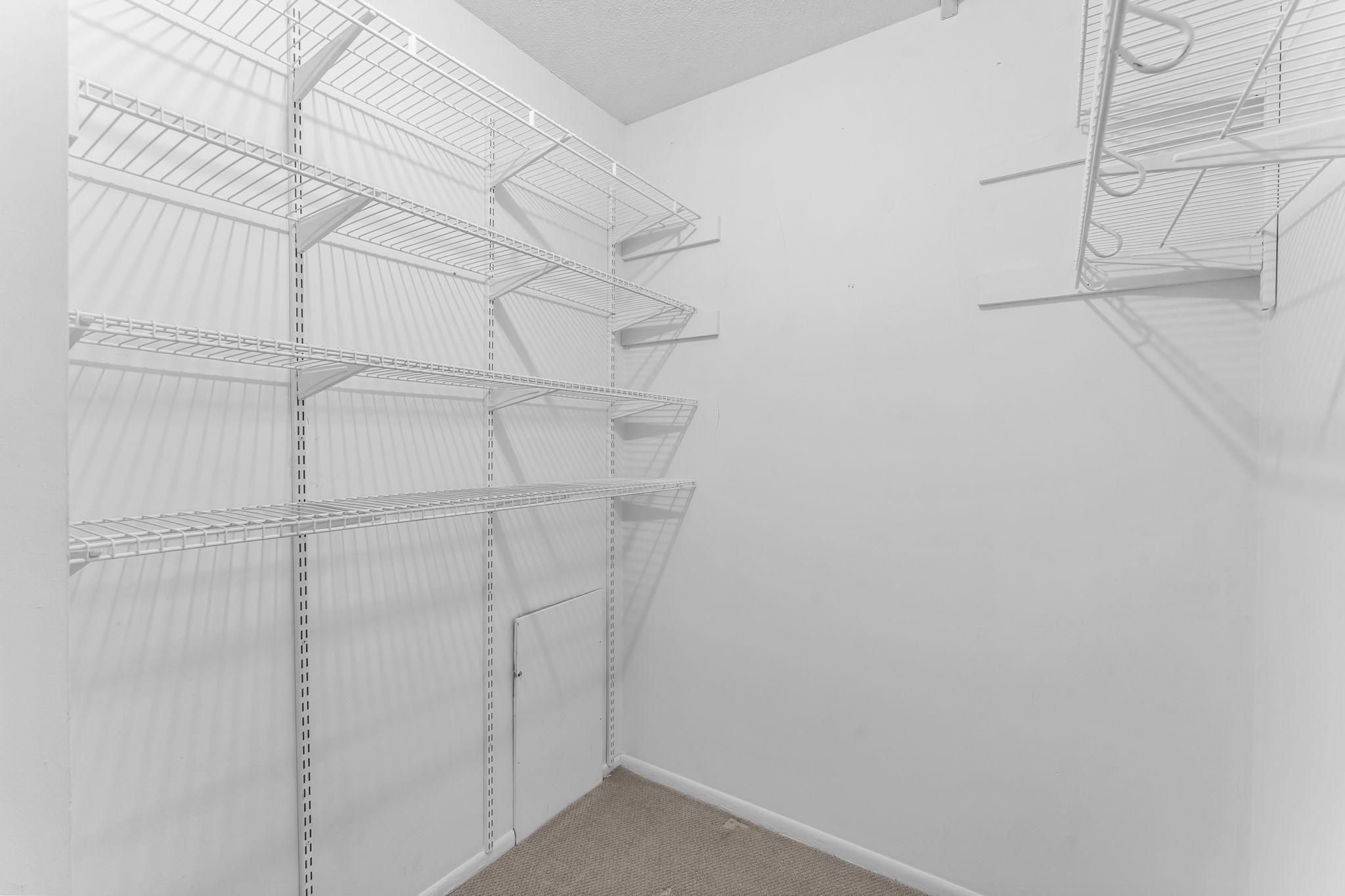 Primary bedroom walk-in closet