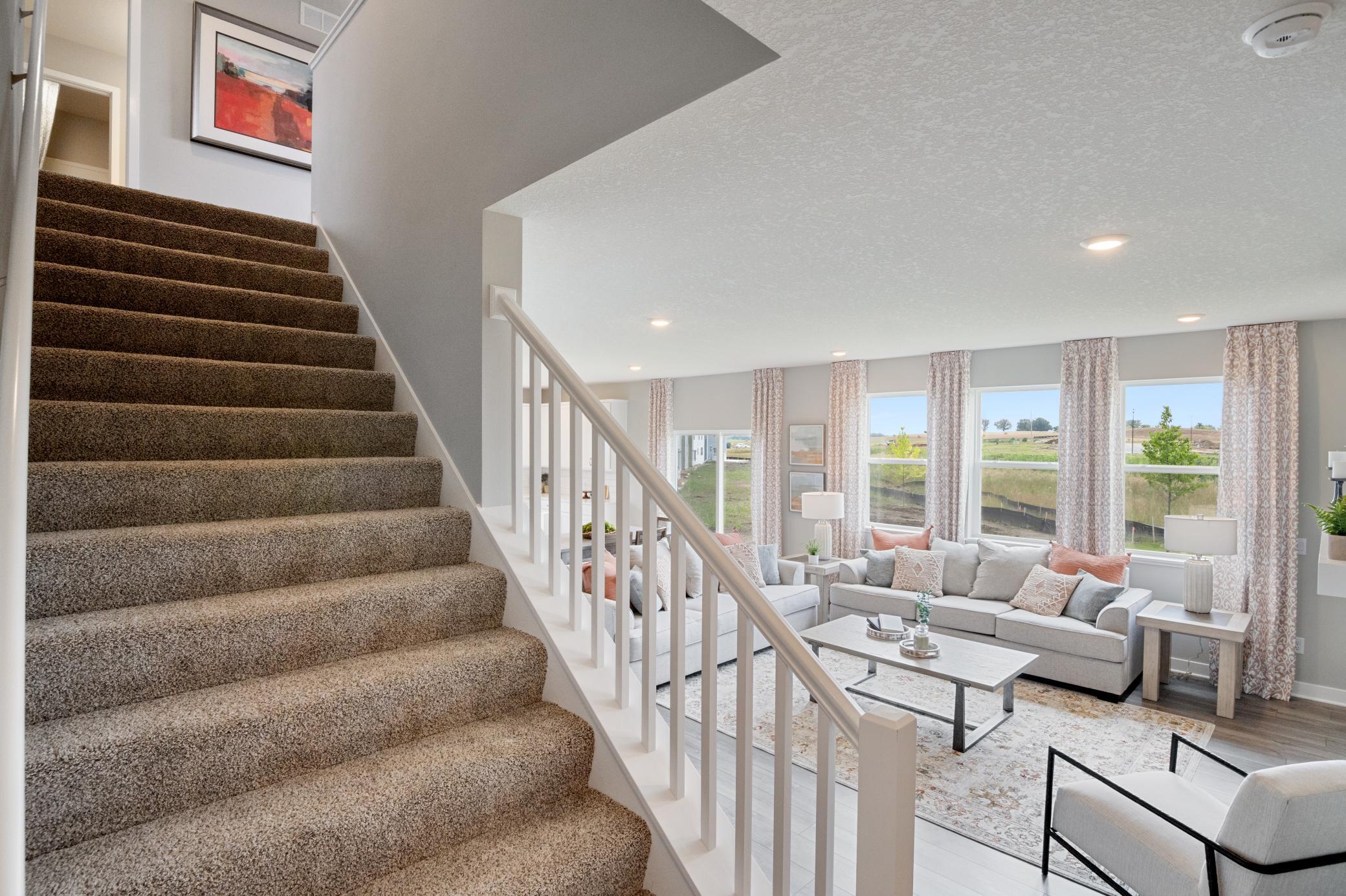 The staircase is extra wide, making moving furniture easy.