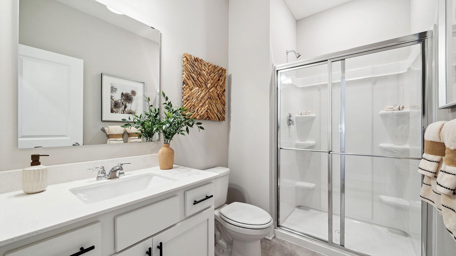 Main floor 3/4 bathroom. Photo of model home, colors and finishes may vary.