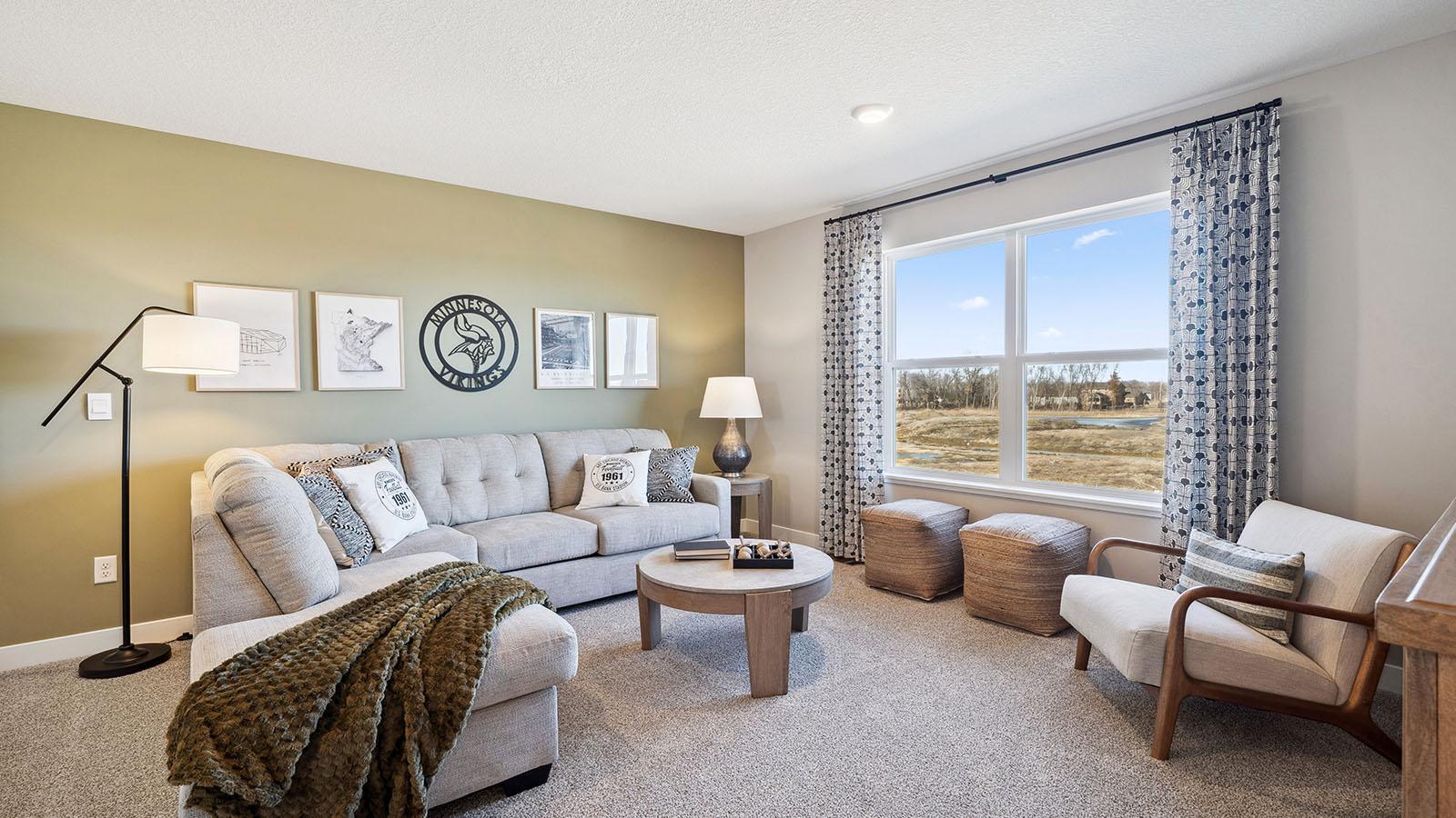 The large upper level loft provides a great second living space for entertainment and relaxation. Photo of model, colors and finishes may vary.