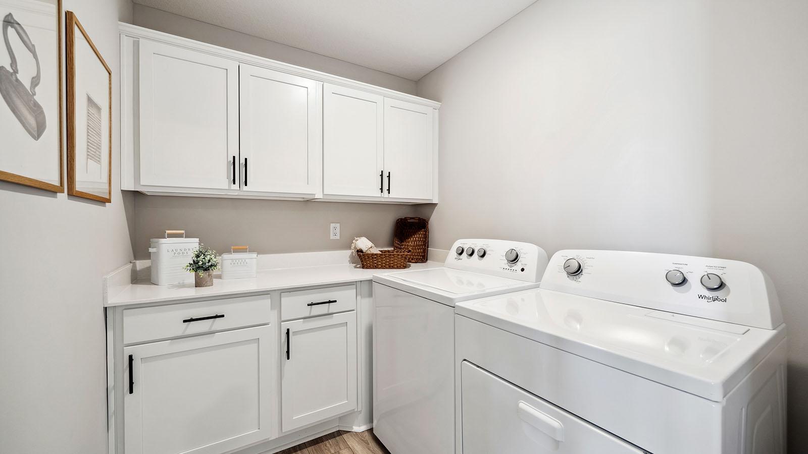 Upper level laundry room come with cabinets! Photo of model, colors and finishes may vary.