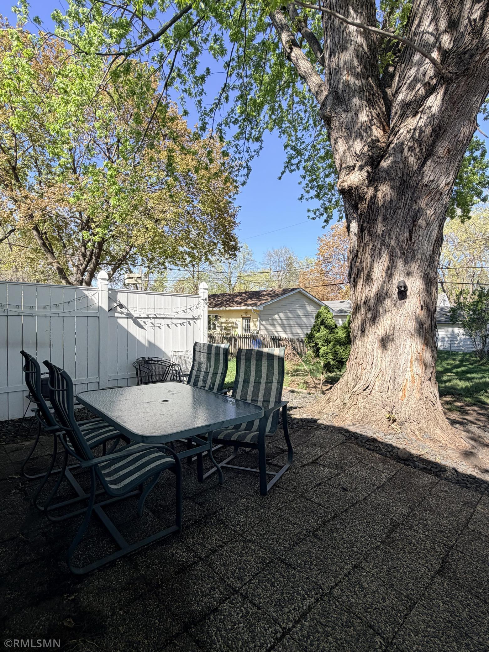 Shaded and inviting fully fenced back yard!