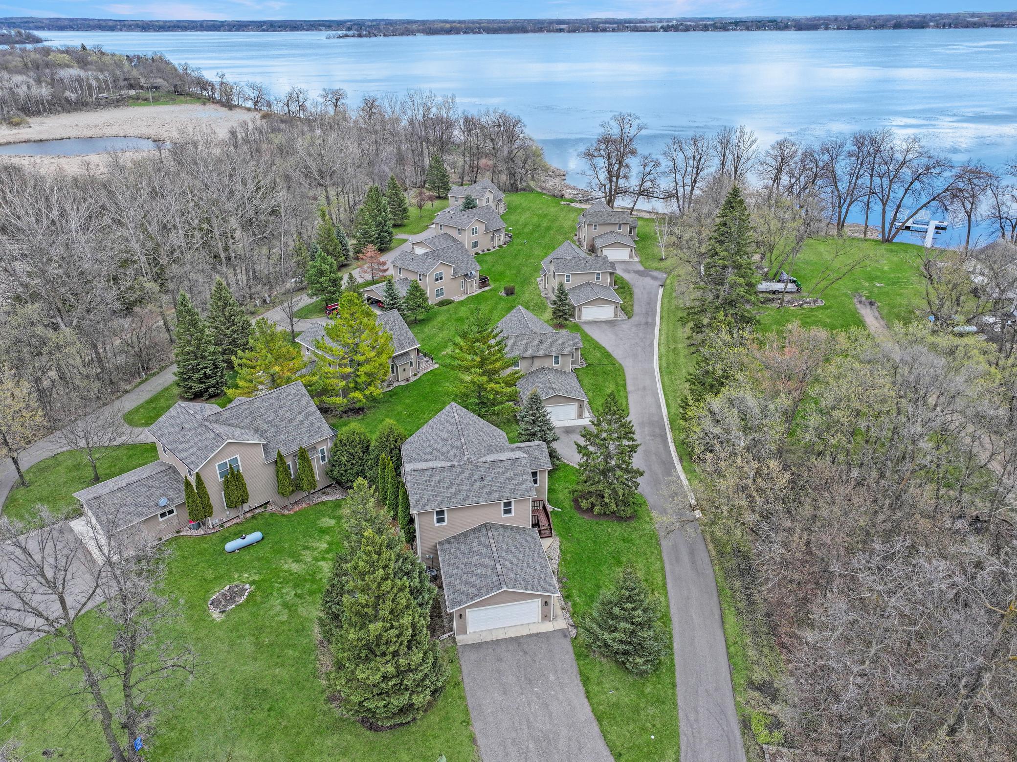 Welcome to easy lake living in this peaceful 9-home association offering a true sense of community