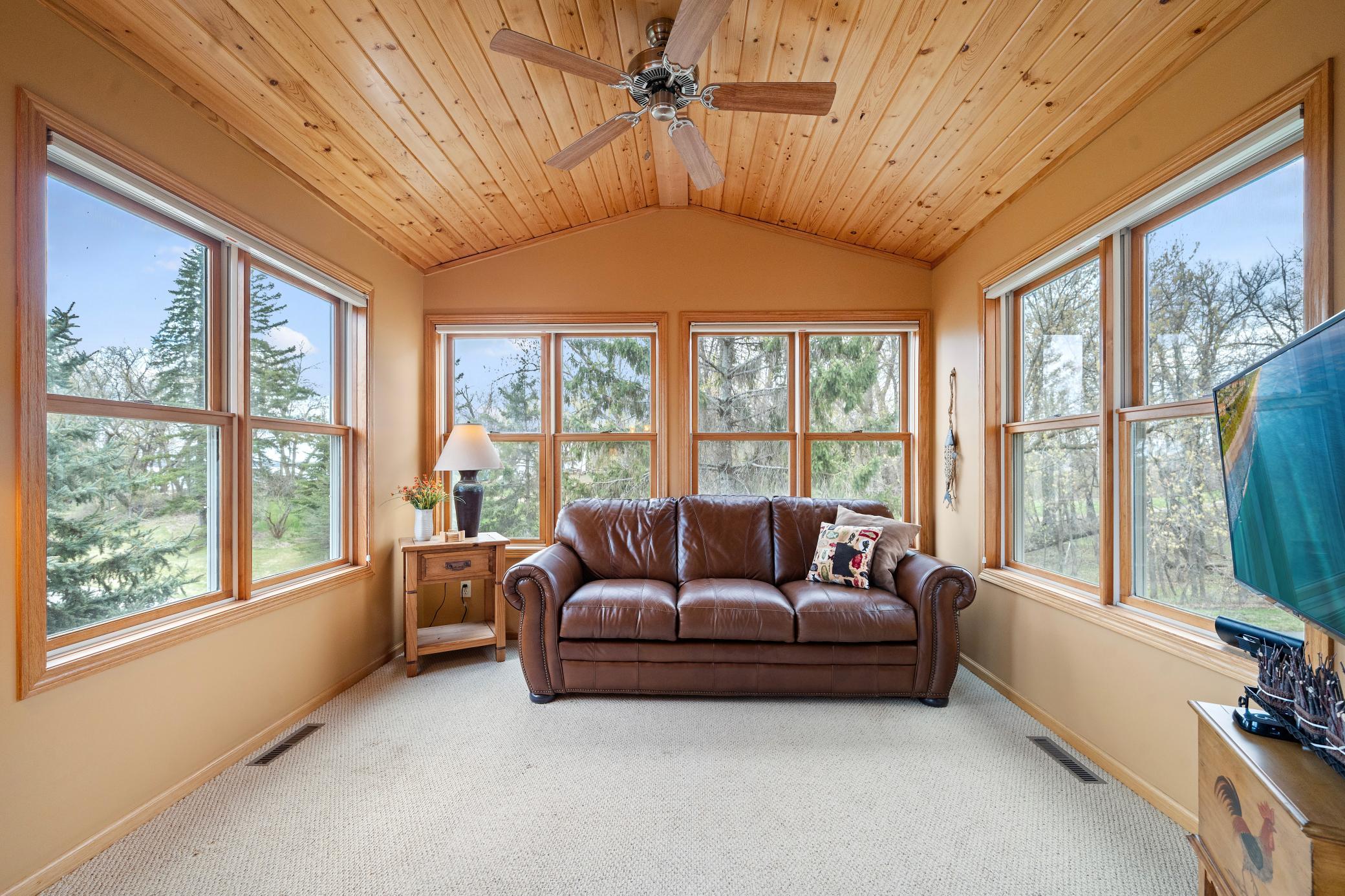 A cozy sunroom with beautiful views