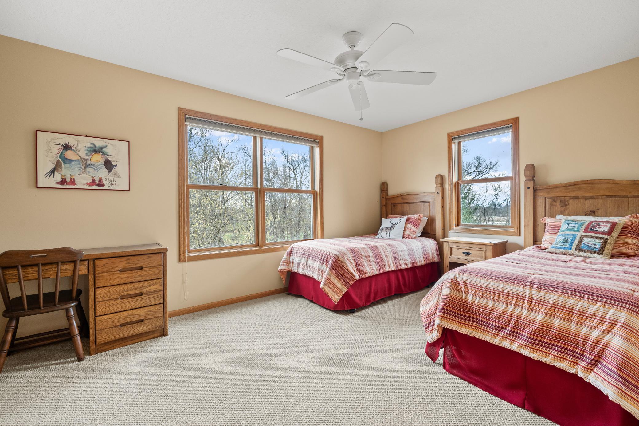 Another spacious bedroom in the upper level with an abundance of natural light