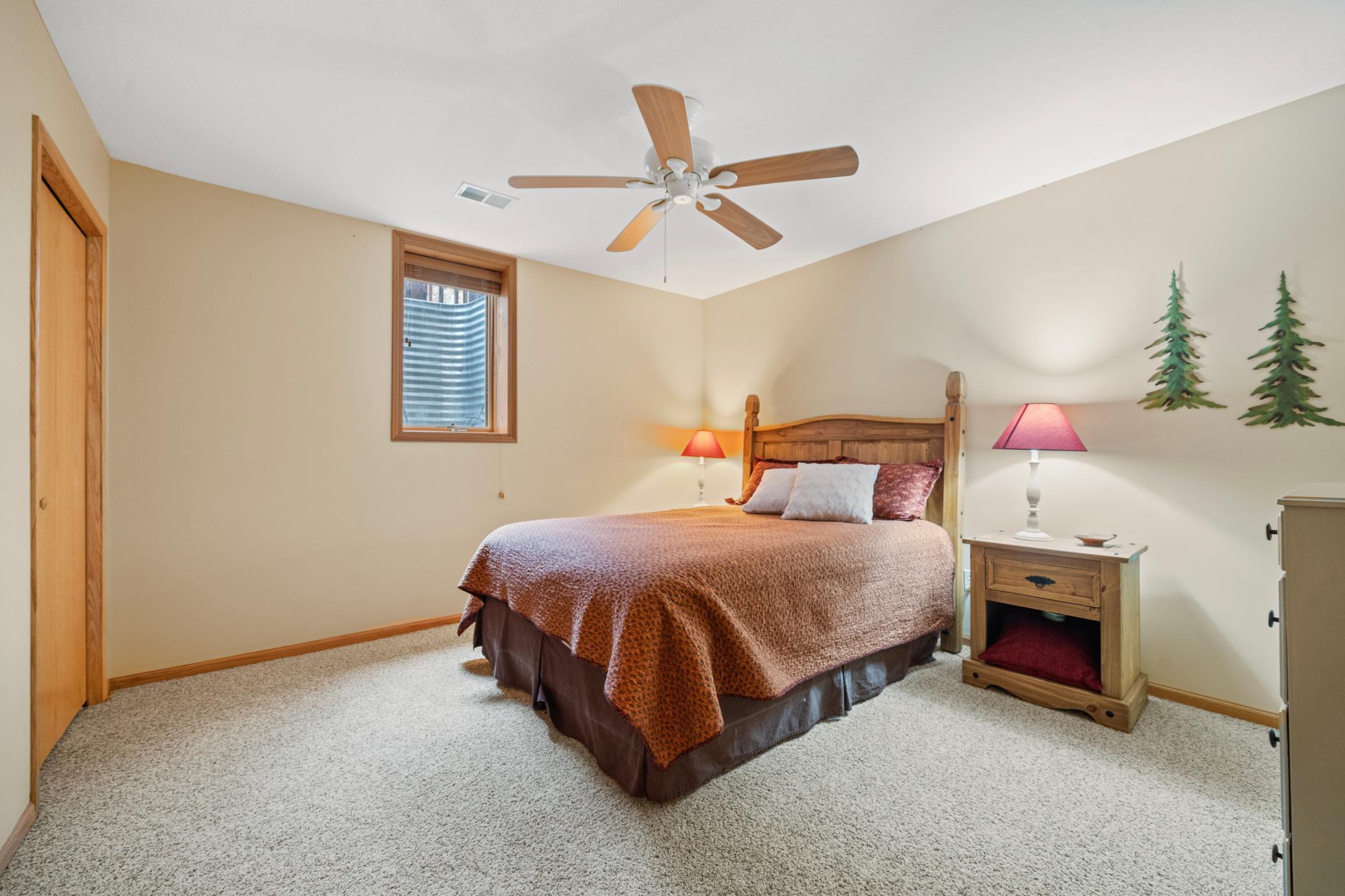 Private bedroom in the lower level has a bathroom with a shower just across the hall.