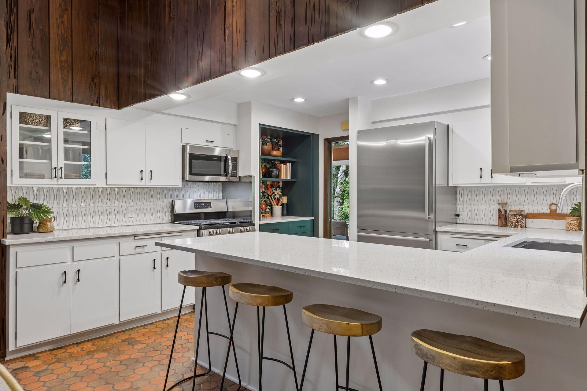 Completely upgraded kitchen. Tile backsplash, stainless appliance and solid stone peninsula and counter tops.