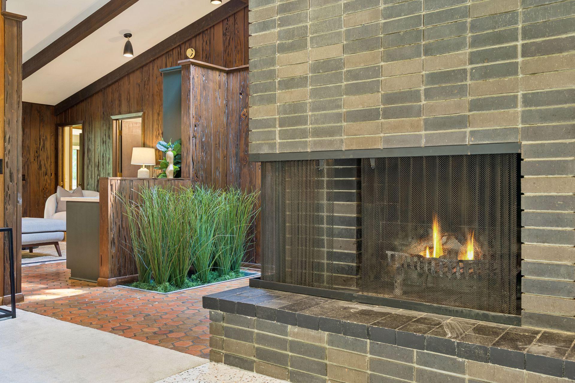 Living room fireplace. Foyer planter.