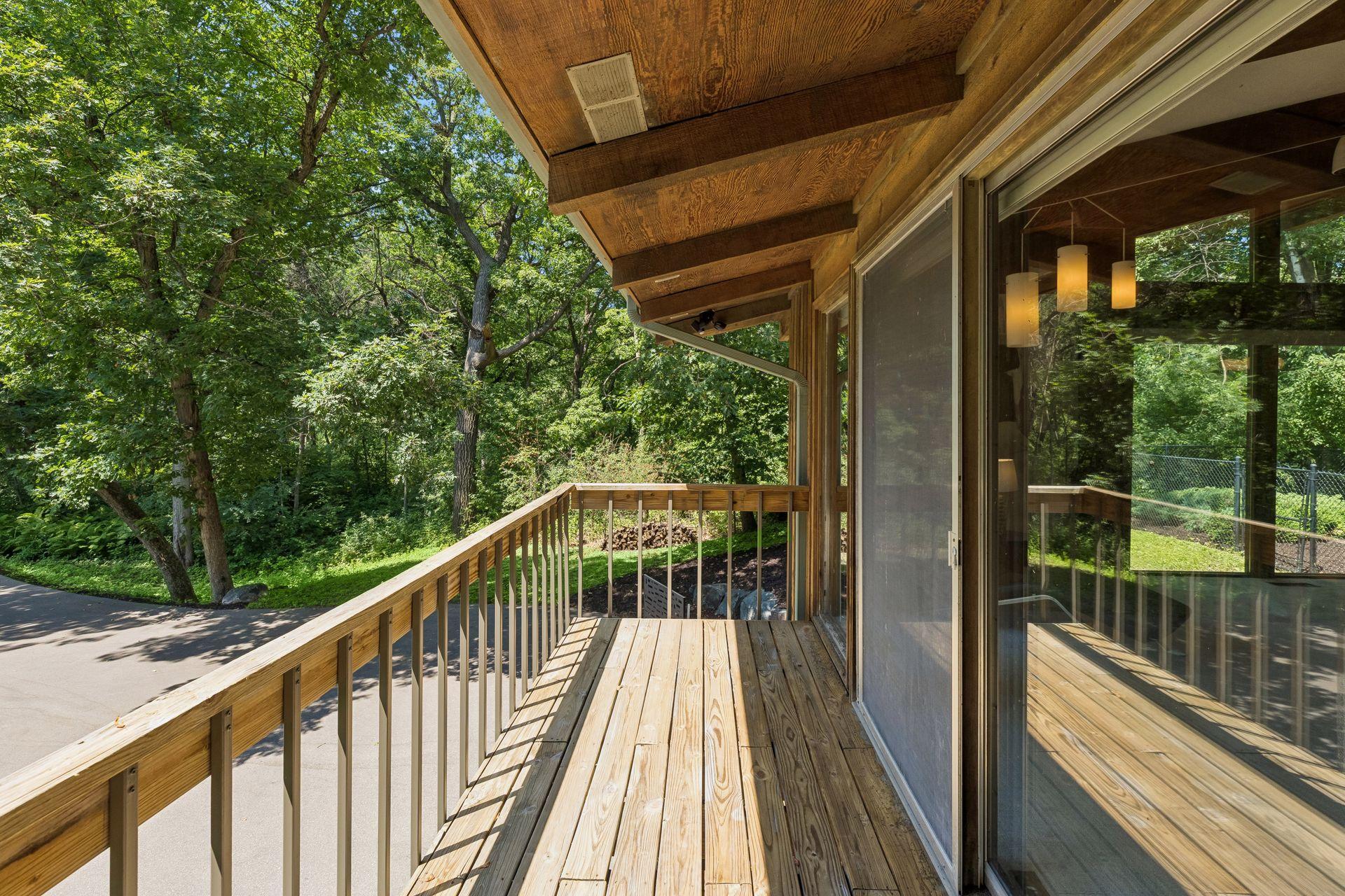 Front balcony leads to living room.
