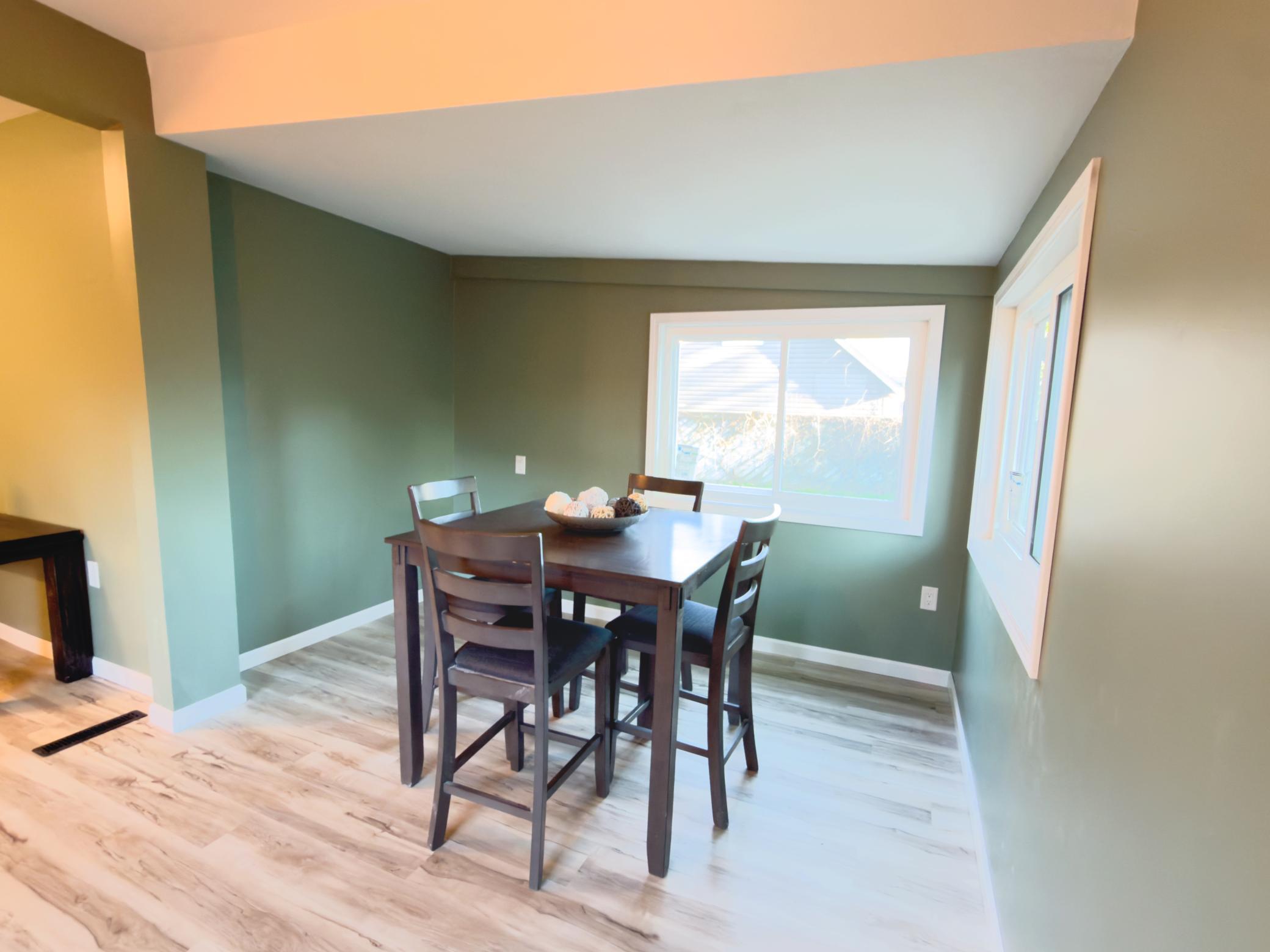 Dining room with professional paint and new windows