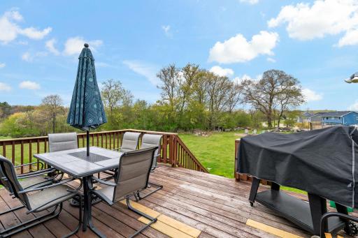 Nice size deck leading to the spacious backyard.
