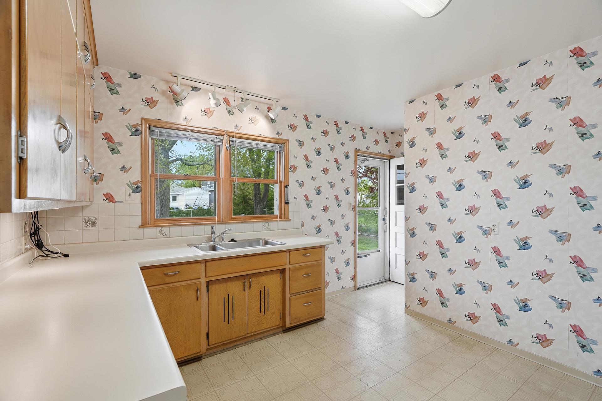 11x13 Kitchen. Large double window overlooking backyard.