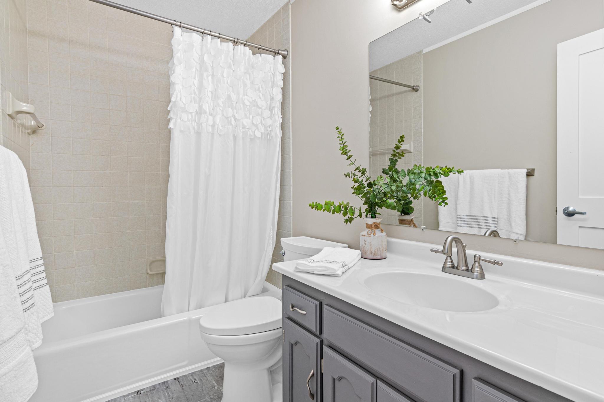 Full bathroom serving the upper-level secondary bedrooms. Designed with both style and convenience in mind for daily use.
