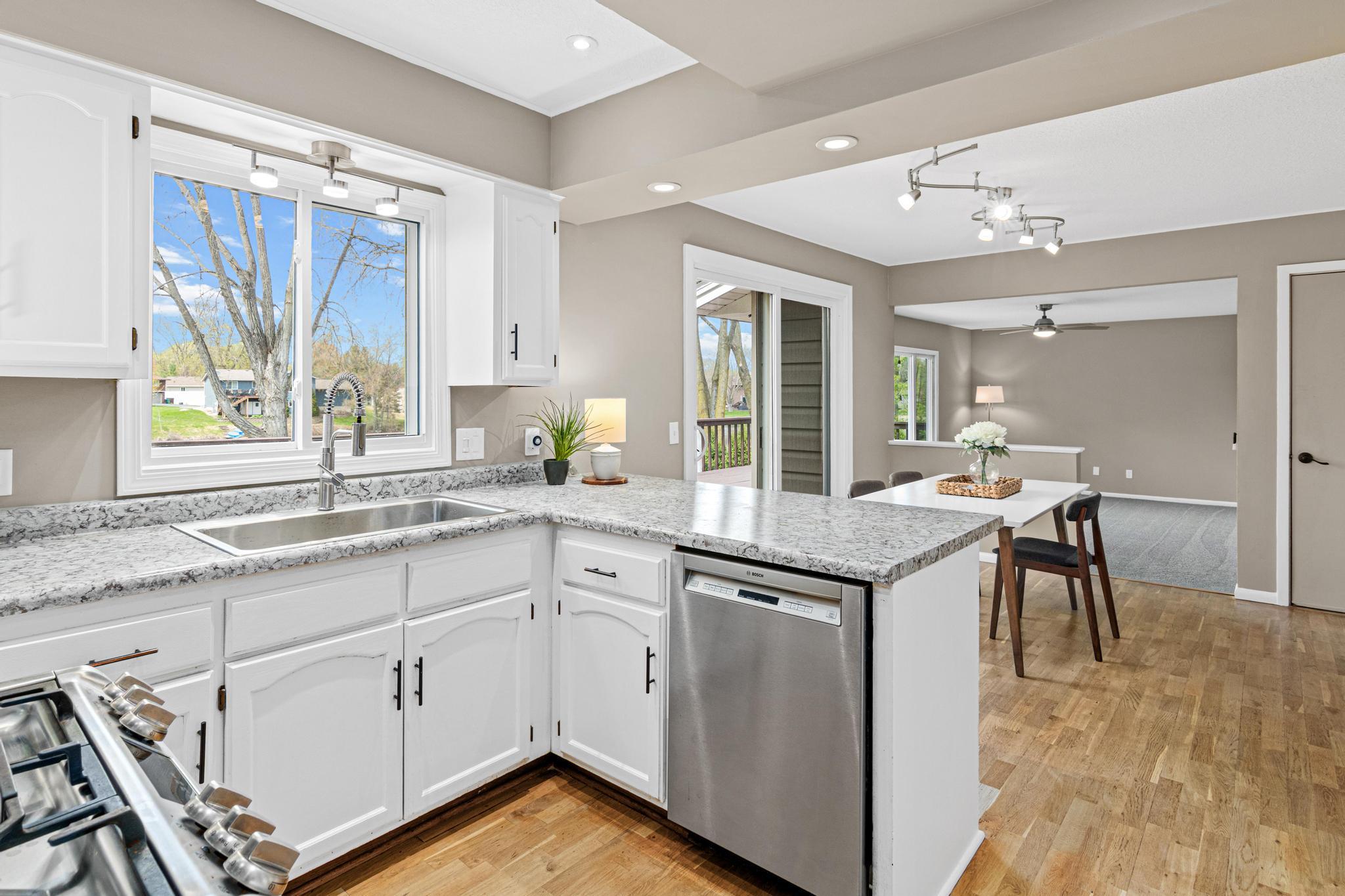 Thoughtfully updated kitchen featuring abundant cabinetry, generous counter space, and a functional layout.