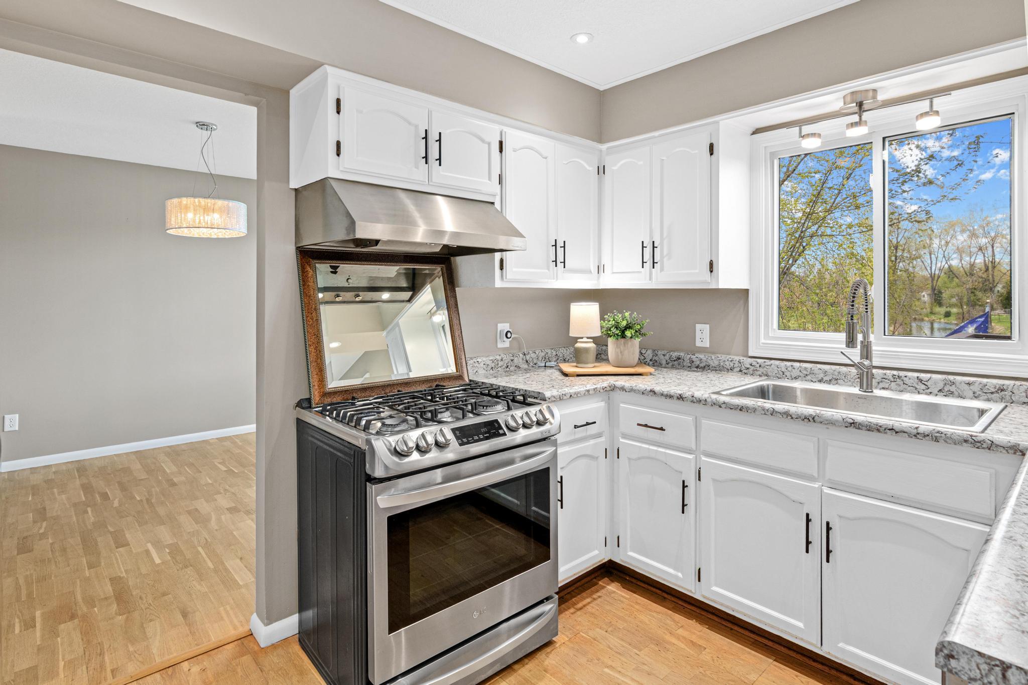 Bright lighting and kitchen window fills the kitchen with lots of light.