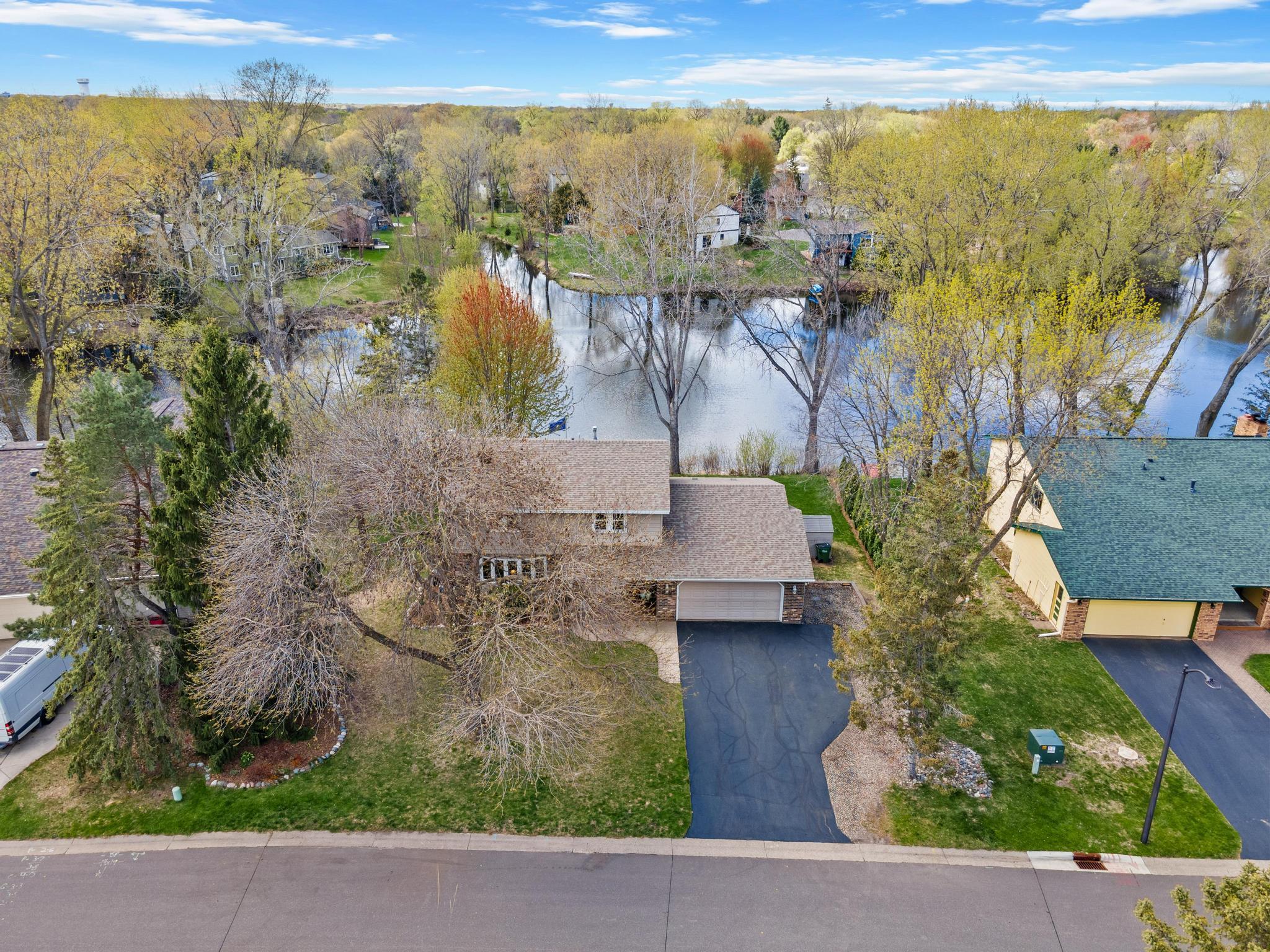 Welcome home! Incredible 4bd/4ba home situated on Evergreen Ponds in Shoreview.