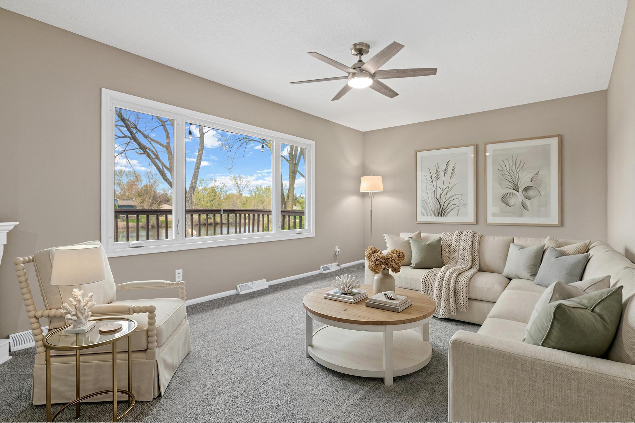 Comfortable and cozy family room designed for everyday living and relaxation. Its welcoming layout makes it the perfect place to gather with family or unwind at the end of the day. Virtually staged.