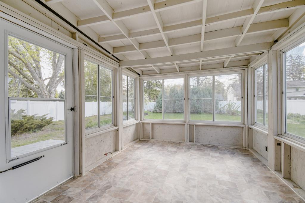 Fully screened in 3 season porch with storm windows overlooks a private backyard!