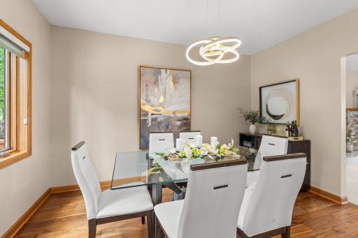 Intimate dining space perfectly situated for dinner parties, featuring direct views into the serene backyard.