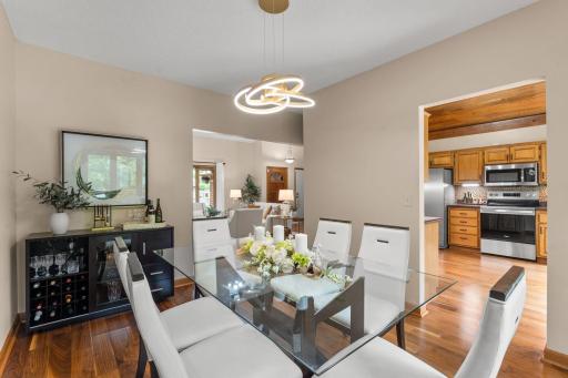 Dining room opens directly to a dry bar area and provides easy transition into the adjacent kitchen space.