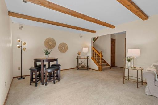 Dedicated game or informal dining area in the lower level, positioned perfectly near the staircase landing.