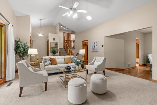 Another view of the living room highlighting the unique multi-level floor plan and excellent flow.