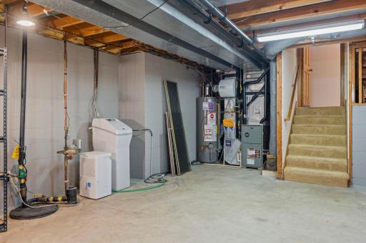 Neat and organized utility space showcasing the home's mechanical systems and lower-level layout.