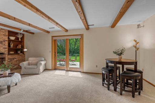 Generous floor plan transitions smoothly from the casual dining space into the comfortable lower-level lounge area.