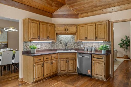 Abundant cabinet storage and counter space, perfectly situated next to the formal dining area.