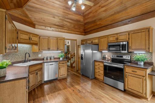 Efficient wrap-around layout maximizing counter space and providing effortless movement through the kitchen.
