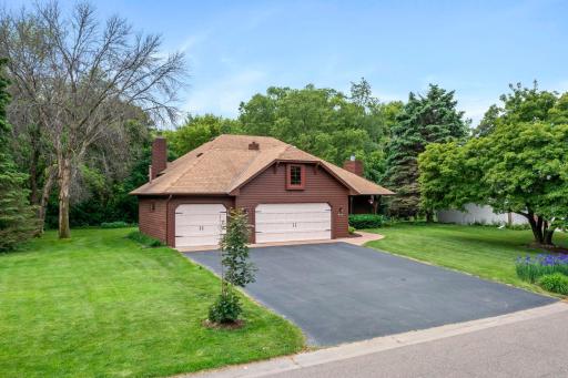 Dynamic angled view of the exterior, showcasing the home's distinctive architectural lines and manicured grounds.