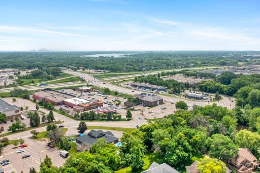 Distance aerial shot highlighting the property's prime location with easy access to nearby shopping centers and major thoroughfares.