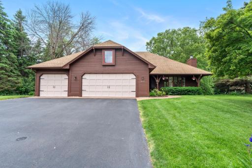 Clear, wide-angle daytime shot accentuating the excellent curb appeal and spacious lot footprint.
