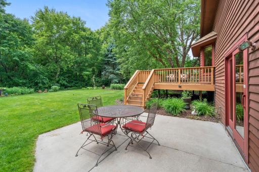 Closer look at the concrete patio area tucked neatly next to the lower-level walkout doors.