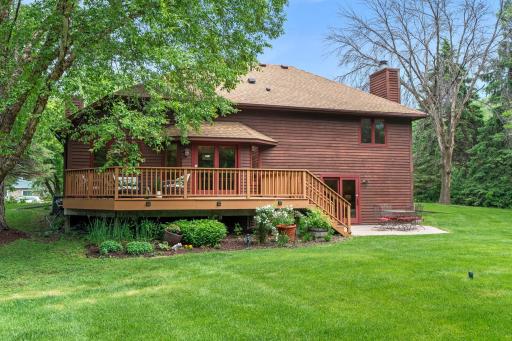 Lower angle view emphasizing the spacious yard footprint and serene, park-like environment.