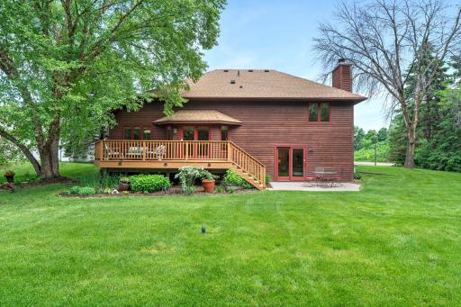 Crisp exterior perspective showcasing the seamless transition from indoor dining areas to the tranquil outdoor deck.