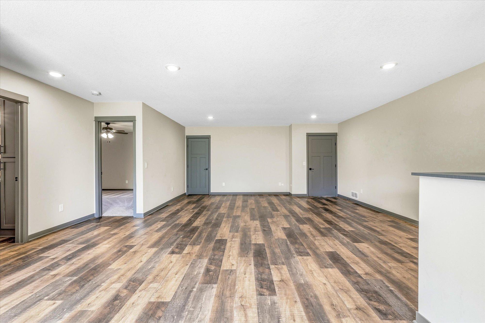Oversized family room offers flexible space for a home gym, media room, play area, or additional entertaining space.