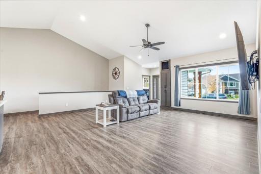 Oversized living room with large picture window and plenty of space for gatherings, movie nights, or relaxing at home.
